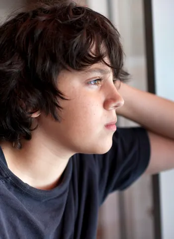 Boy looking out a window